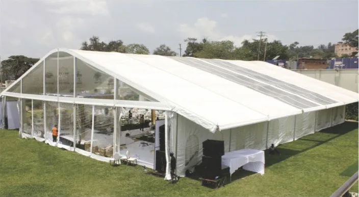 White A-frame event tent on grass with a transparent gable end
